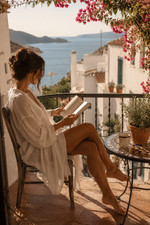 Listing image for Woman Reading on a Mediterranean Balcony Poster Print Framed Canvas Wall Art